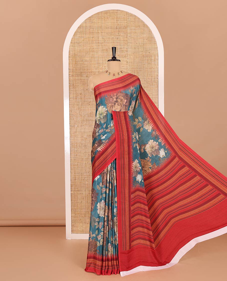 Teal blue floral printed Italian crepe saree, contrast temple printed border, striped pallu, and a printed bordered blouse