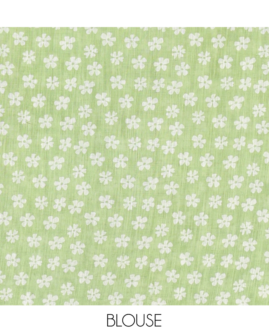 Green Linen Cotton Saree Features Half-And-Half-Style Flower Motifs Print, a Piping Border, and a Matching Blouse