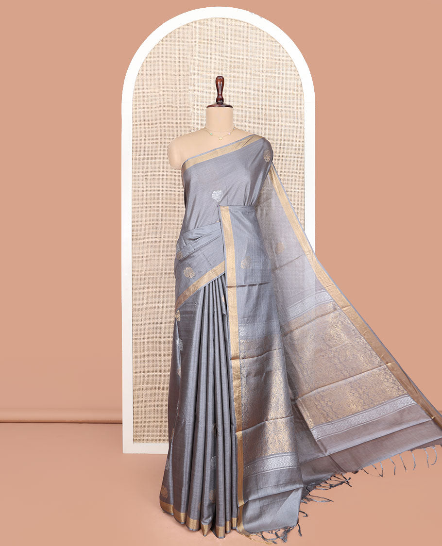 Grey Tussar Silk Saree, Sparsely Woven with Zari Buttas on Its Body, Subtly Woven Bavanji Border, Intricately Zari-Designed Pallu, and Paired with a Matching Blouse