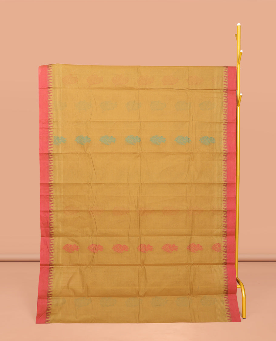 Mustard Kanchi Cotton Saree, Ornamented with Buttas All Over Its Body, Complemented by a Contrast Temple Border, Pallu of Floral Design, and Paired with a Matching Blouse
