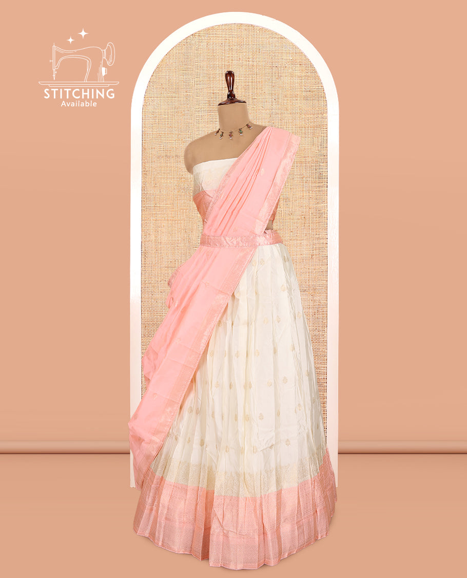 Cream-Peach Semi-Silk Half-Saree, Subtly Sparkled with Zari Buttas Skirt, a Contrast Traditional Zari Border, and a Contrast Dhavani
