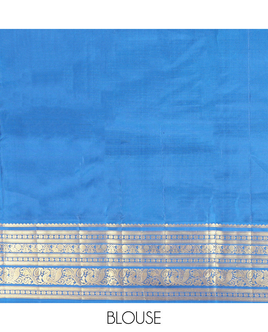 Orange Vasundhara Silk Saree, Subtly Sparkled With Zari Buttas All Over Its Body, Complemented by Contrast Border of Salngai, Muthu, Kamalam, Jada Nagam, and Mayil Designs, Grand Pallu and Paired with a Contrast Blouse