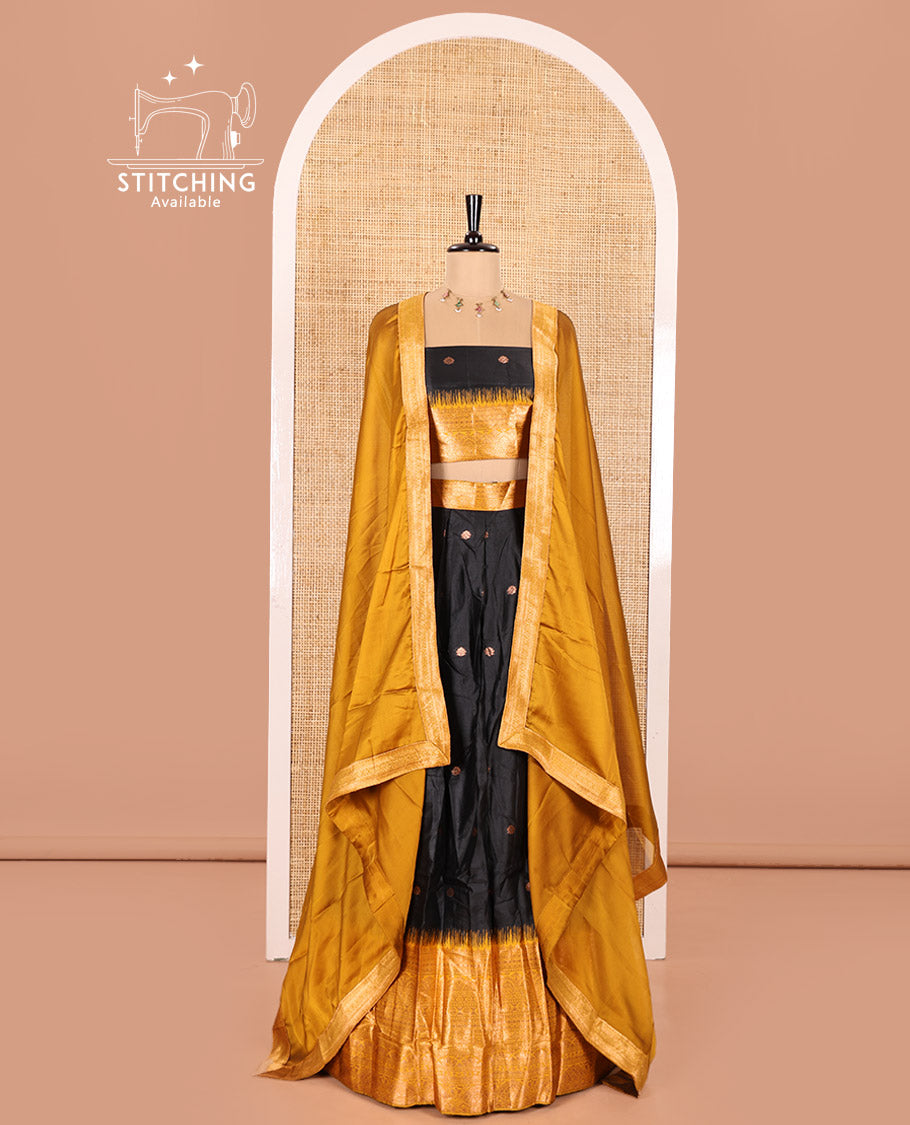 Black and Mustard Semi-Banaras Half-Saree Featuring Zari Buttas All Over the Skirt, Accentuated with a Contrast Traditional Zari Design Border, Paired with a Matching Blouse, and Has a Plain Syska Georgette Dhavani with a 4-Sided Zari Border