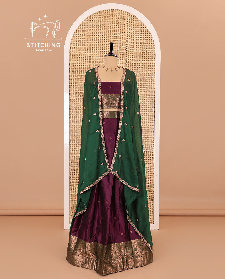 Purple taffeta silk half-saree, zari buttas with contrast traditional zari bordered skirt, matching zari design blouse, and contrast scallop buttas embroidered dhavani