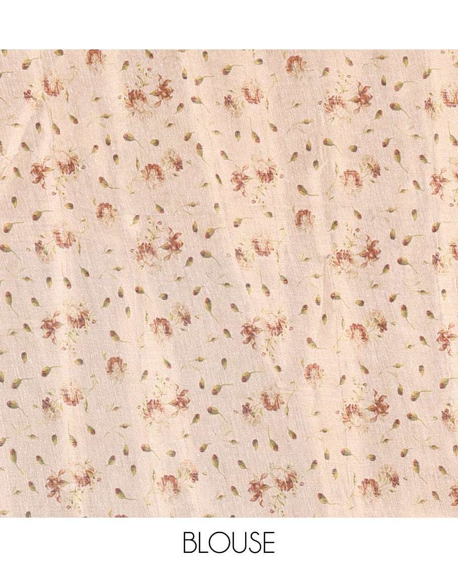 Cream leaf and floral printed tissue saree with border and pallu of floral and leaf print, a small floral printed blouse