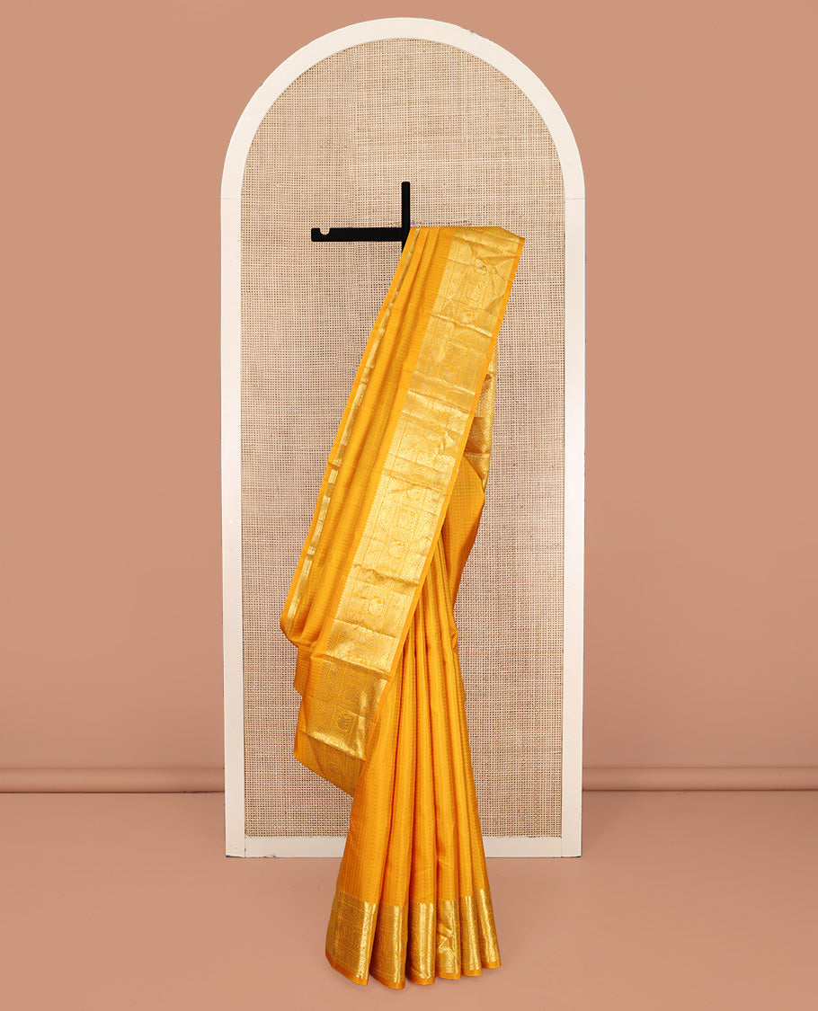 Yellow Kanchipuram Silk Saree, Sparsely Woven with Checked Design All Over Its Body, Highlighted by a Zari Border of Manga, Yaanai, and Mayil Designs, Pallu of Jaal Designs, and Paired with a Matching Blouse