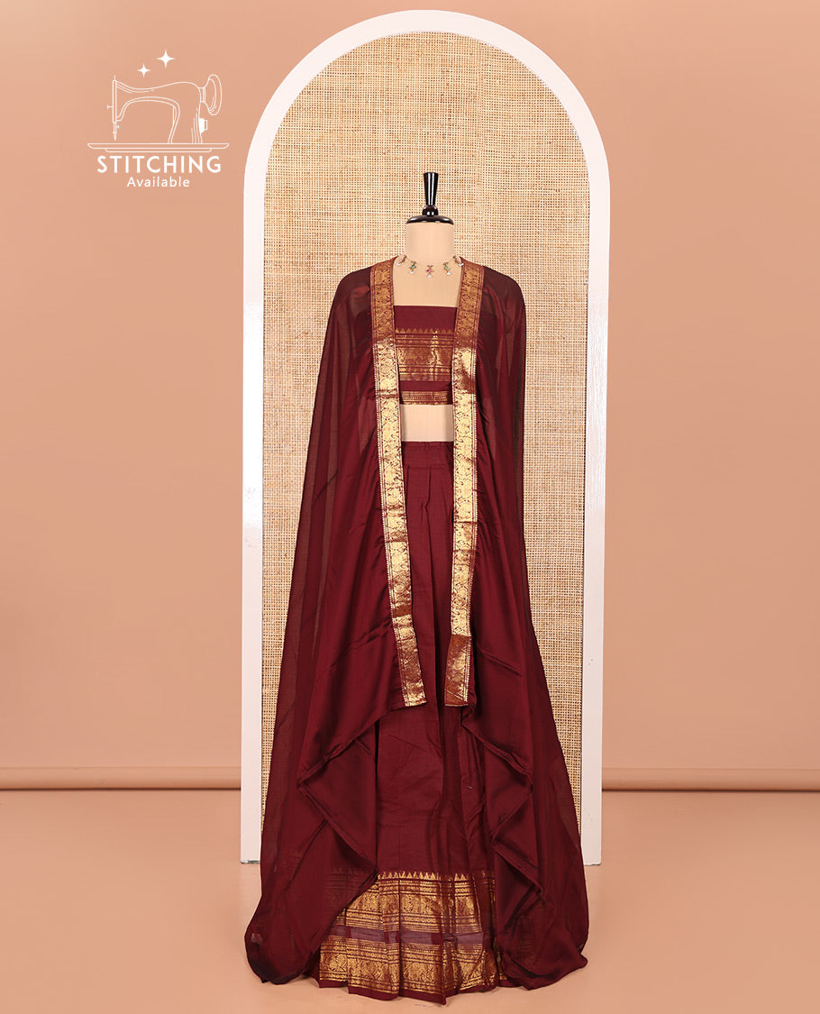 Maroon Chettinad Cotton Half-Saree Featuring Plain Skirt, Elevated with a Contrast Traditional Zari Design Varisai Pettu Border, Paired with a Matching Blouse, and a Satin Georgette Zari Bordered Dhavani