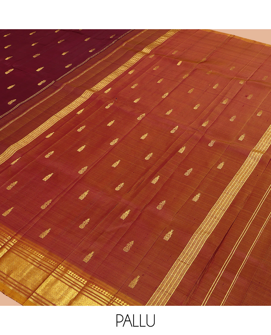 Maroon Kanchipuram Silk Saree, Accentuated with Zari Buttas, a Contrast One-Sided Border of Paneer Sombu, Rekku, Banaras, Muthu, and Mayil Kann Design, Zari Design Pallu, and No Blouse