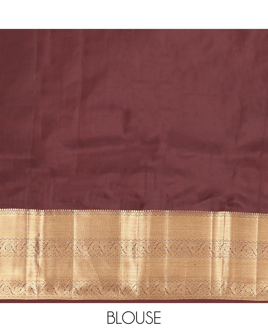 Brown Vasundhara Lite Silk Mix Saree, Decked Up with Zari Buttas All Over Its Body, Highlighted by a Zari Border of Salngai, Muthu, Dhavana Kodi, and Mayil Kann Designs, Pallu of Leaf Vine Designs, and Paired with a Matching Blouse