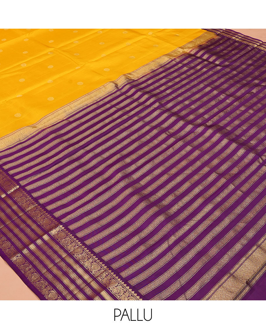 Yellow Vasundhara Silk Saree, Sparsely Woven with Zari Buttas All Over Its Body, Complemented by a Contrast Border of Thilakam, Muthu, Mayil, and Mayil Kann Designs, Pallu of Zari Designs, and Paired with a Contrast Blouse