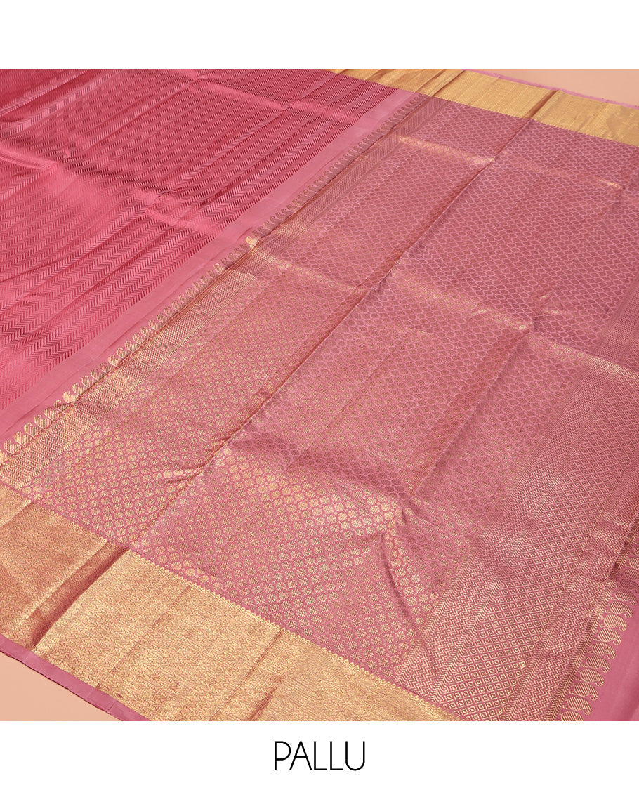 Pink Embossed Parampara Silk Saree, Highlighted by Zari Border of Thilakam and Vanki Designs, Pallu Steeped with Rudraksham Designs, and Paired with a Matching Blouse