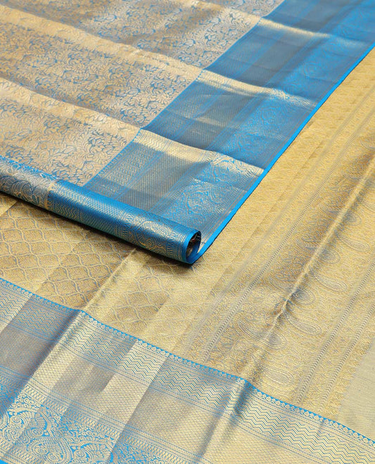 Blue floral jacquard kancheepuram tissue silk saree with contrast korvai border of thilakam mokku, kathir, mayil kann design & zari design pallu