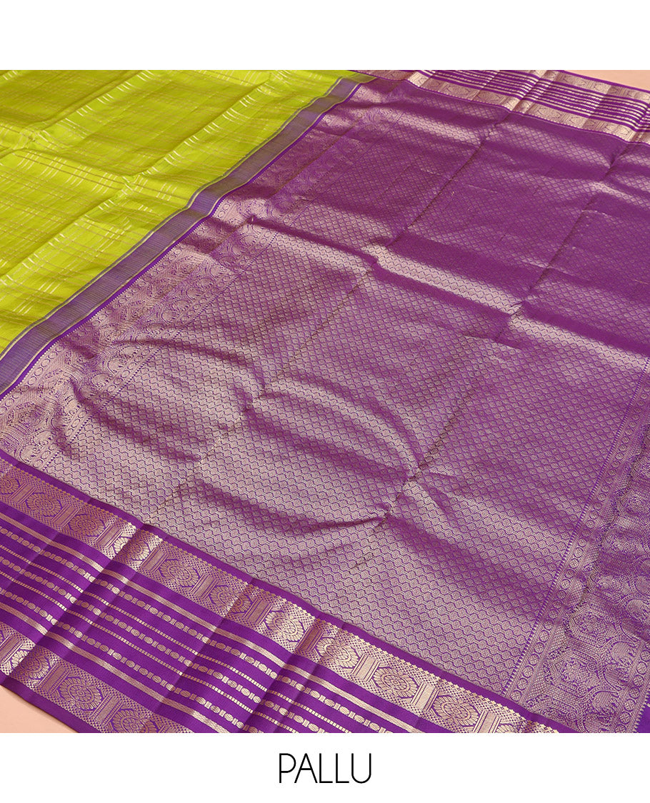 Green Vasundhara Silk Saree, Spotlighted with Zari Checked Design All Over Its Body, Complemented by a Contrast Varisai Pettu Border of Muthu, Poun, and Chakram Designs, Grandly Embellished Pallu of Jaal Designs, and Paired with a Contrast Blouse