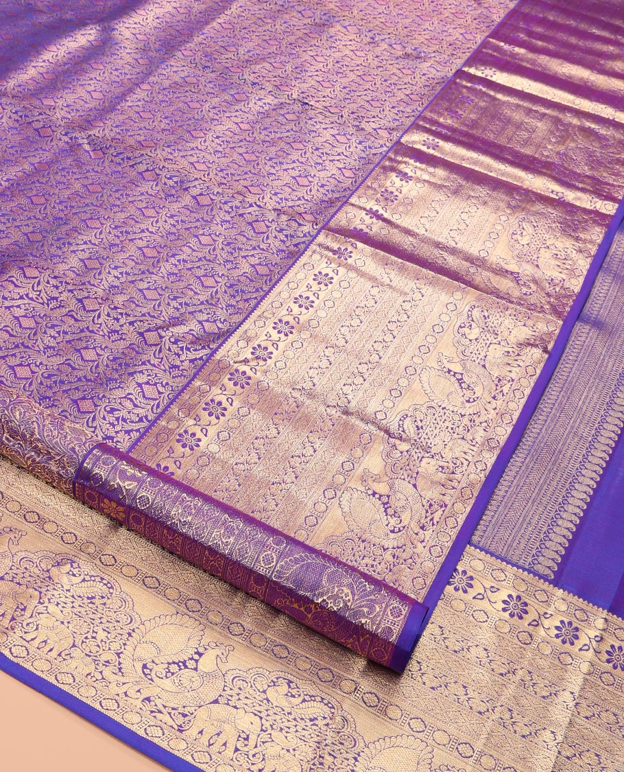 Violet Kanchipuram Wedding Silk Saree, Accentuated with Jacquard Design, a Zari Border of Thilakam, Poun, Diamond, Kodi Visiry, Mayil, and Yaanai, Grand Pallu, and a Matching Blouse