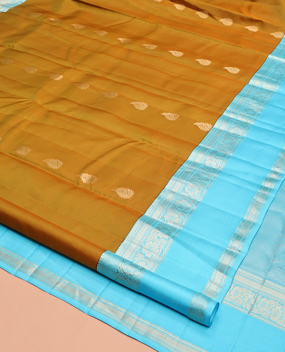 Mustard Vasundhara Silk Saree, Woven with Zari Buttas, Contrast Rettai Pettu Border of Thilakam Mokku, Neli, Mayil Kann, and Kodi Visiry Designs, Grand Pallu, and a Contrast Blouse