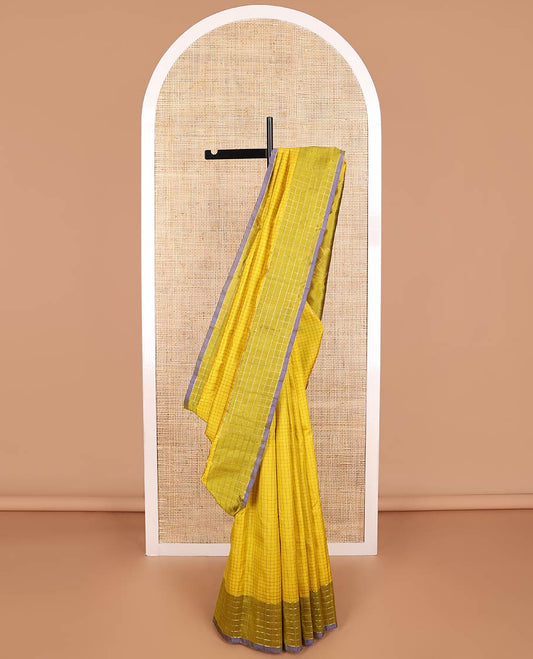 Light green checked kancheepuram silk saree with contrast checked border & floral design pallu