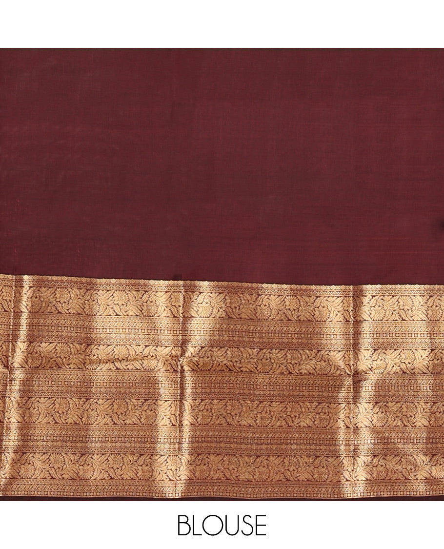 Scintillating Brown Vasundhara Lite-Silk Mix Saree, Gleamed Up with Zari on Its Body, Highlighted by Thazampoo Rekku Border of Neli, Paisa, Cross Kamalam, and Kodi Visiry Designs, a Grand Geometric-Patterned Pallu, and Paired with a Matching Blouse