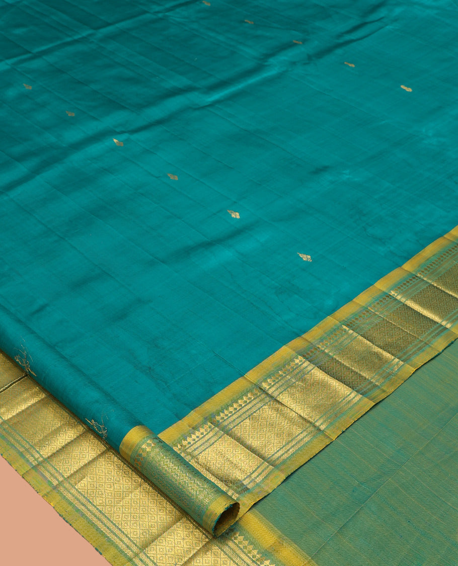 Green Kanchipuram Silk Saree, Adorned with Zari Buttas, Complemented by a Contrast Border of Panner Sombu, Banaras, and Mayil Kann Design, Pallu of Zari Design, and No Blouse