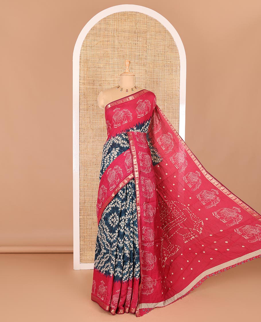 Blue shibori printed muslin cotton saree, contrast zari border of elephant motifs print, big elephant printed pallu, and a contrast printed blouse