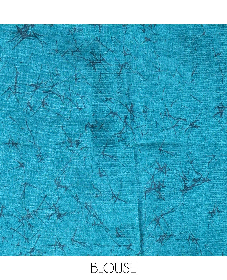 Borderless blue fancy motifs batik-printed art khadi silk saree, contrast printed pallu, and a printed blouse
