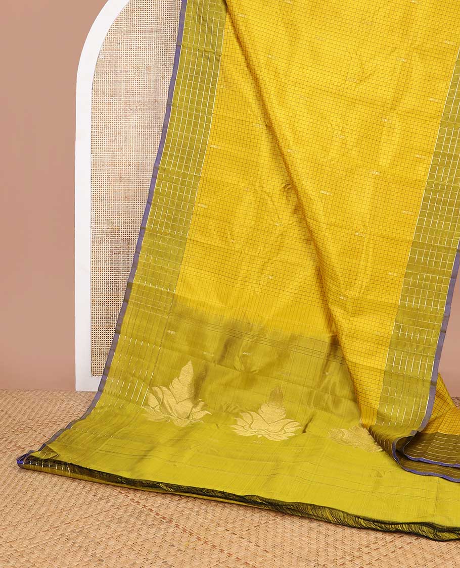 Light green checked kancheepuram silk saree with contrast checked border & floral design pallu