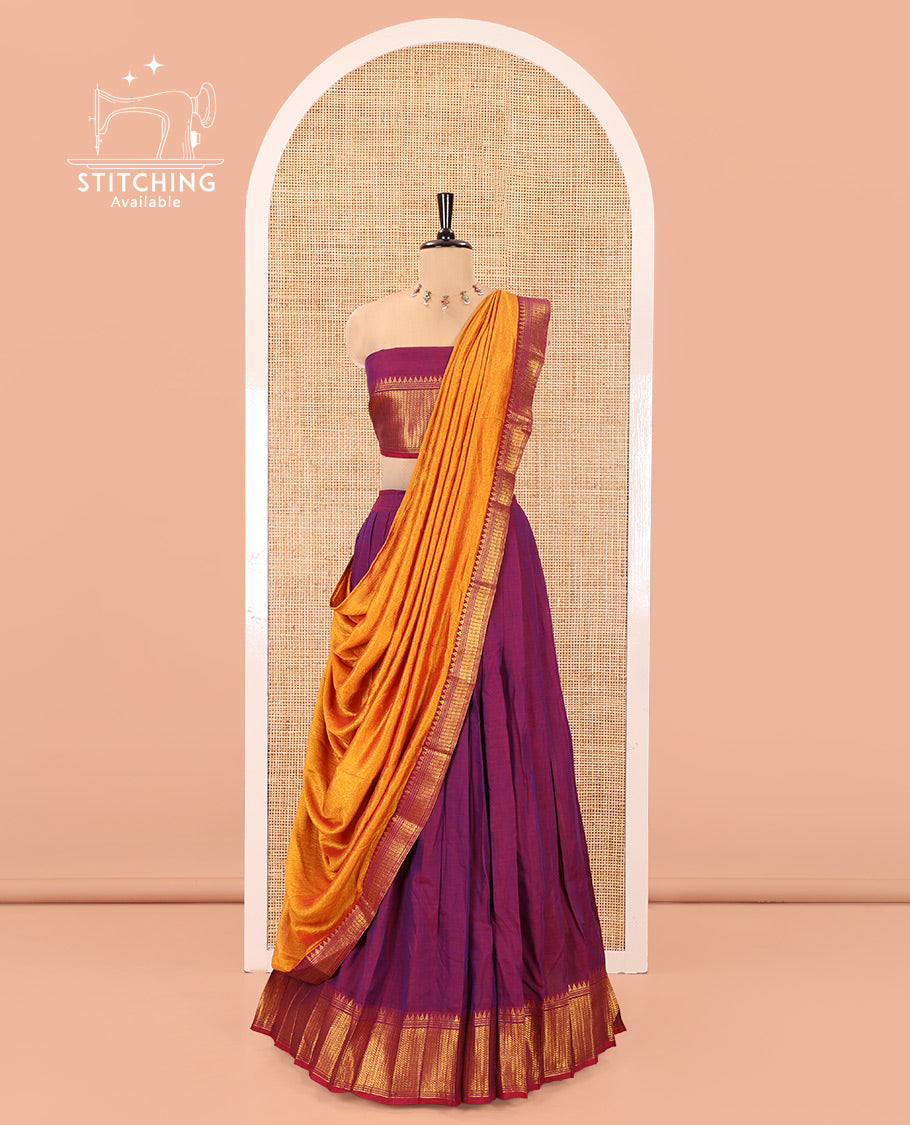 Magenta Mercerised Cotton Half-Saree Features Plain with Contrast Traditional Zari Temple Bordered Skirt, Paired with a Matching Blouse, and Comes with a Contrast Zari-Bordered Dhavani
