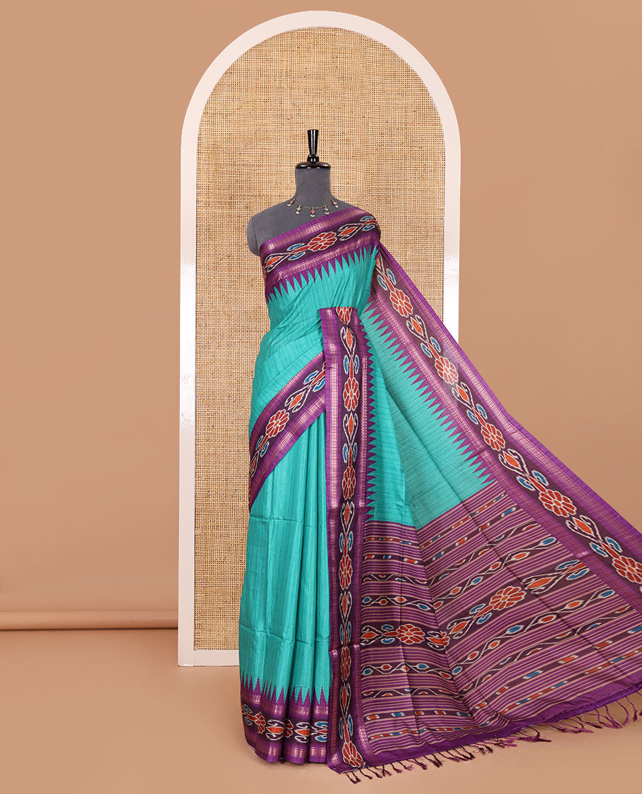 Rama green plain Katan silk saree, contrast temple ikkat floral printed border, ikkat floral printed pallu, and ikkat printed blouse