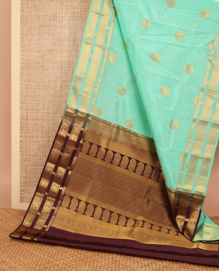 Sea green buttas vasundhara elite silk saree with self zari design border & floral design pallu