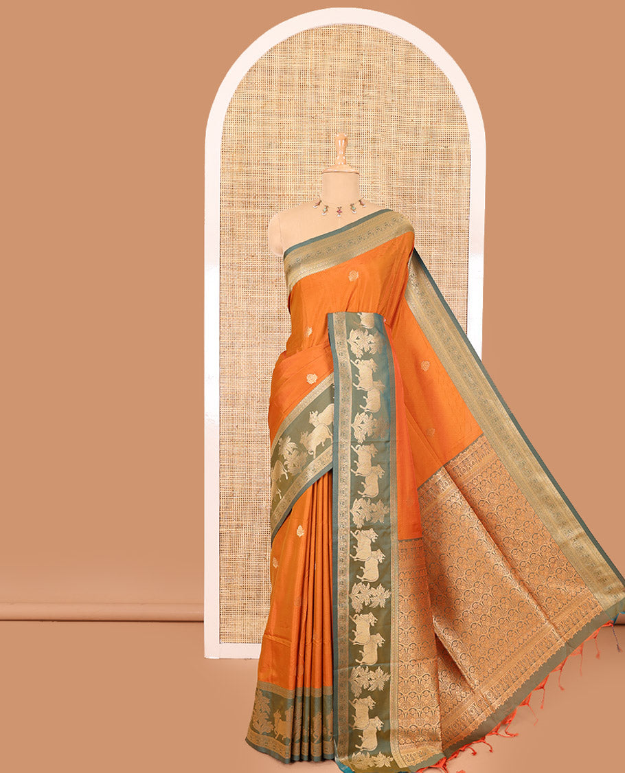 Orange zari buttas elite soft silk saree, contrast traditional zari border of Pichwai cow design, scallop pallu, and a contrast zari design blouse