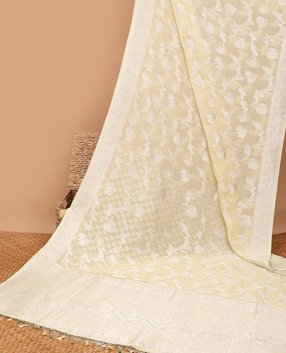 Pale yellow floral jacquard semi-banaras crepe saree, floral creeper border & intricate pallu
