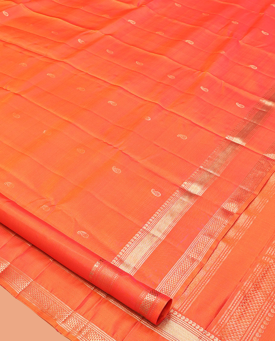 Orange Kanchipuram Silk Saree, Ornamented with Manga Buttas, Highlighted By Zari Rettai Pettu Border of Manga, Banaras, Mayil Kann, and Arai Maadam Design, Grand Pallu, and a Matching Blouse