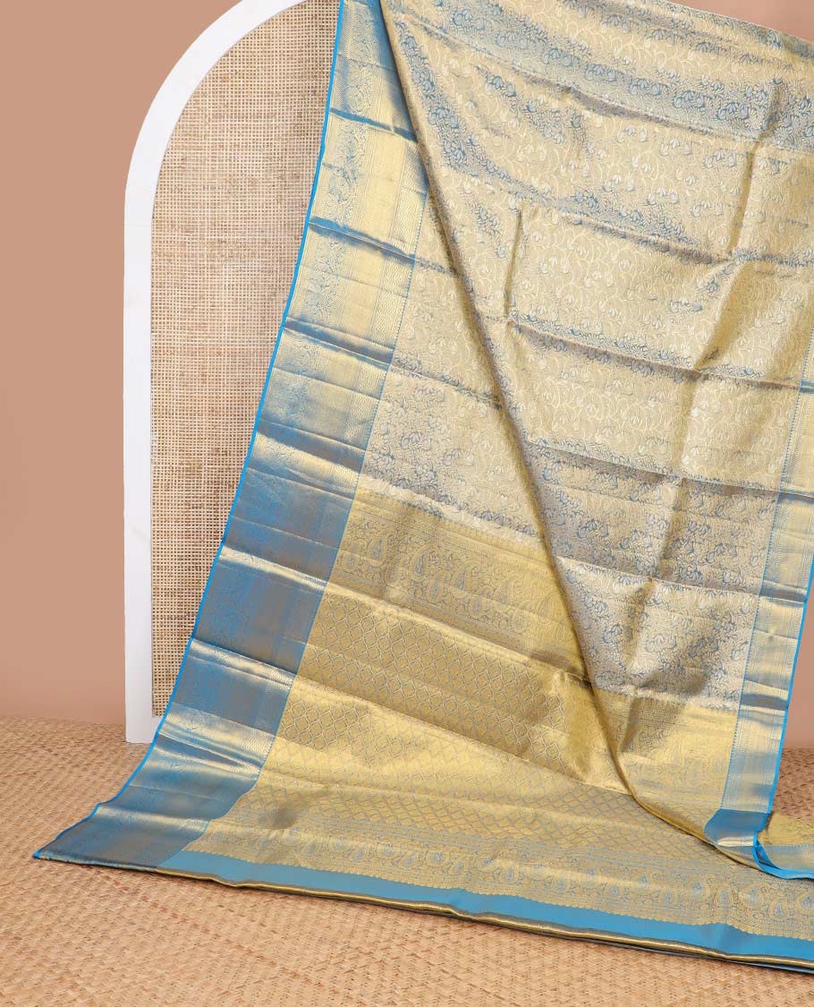Blue floral jacquard kancheepuram tissue silk saree with contrast korvai border of thilakam mokku, kathir, mayil kann design & zari design pallu