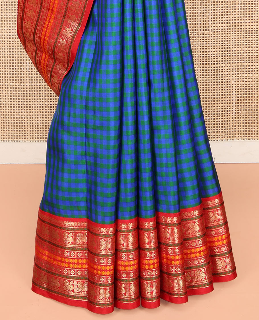 Blue and Green Kanchipuram Silk Saree, Decked Up with Checked Design on Its Body, Complemented by a Contrast Border of Thilakam Mokku, Mayil, Laddu Kamalam, and Rudraksham Designs, Pallu Steeped with Traditional Designs, and Paired with a Contrast Blouse