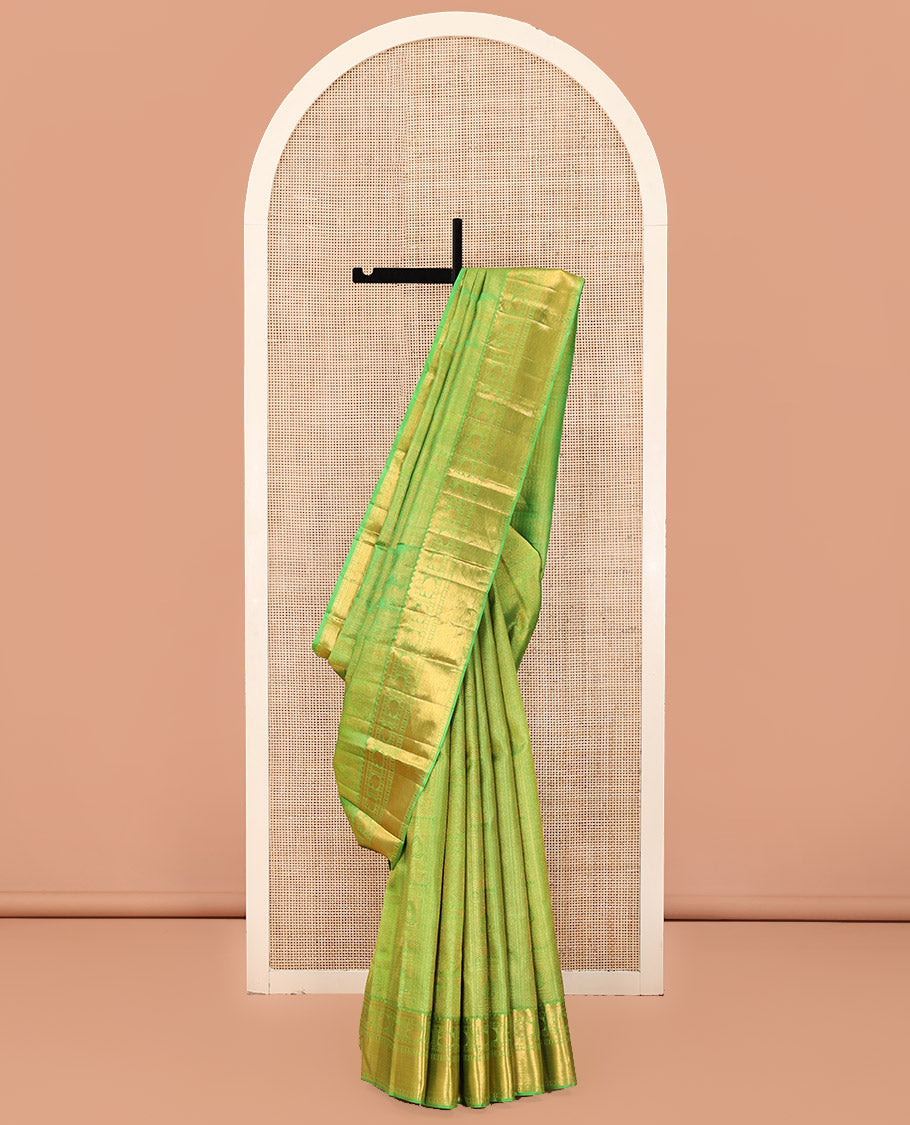 Green Kanchipuram Wedding Silk Saree, Entralled with Jacquard Design On Its Body, Highlighted by Zari Border of Rekku, Kathir, Muthu, Manga and Zari Stripes, Grand Pallu and Paired with a Matching Blouse