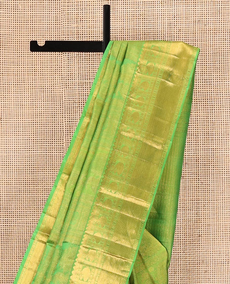 Green Kanchipuram Wedding Silk Saree, Entralled with Jacquard Design On Its Body, Highlighted by Zari Border of Rekku, Kathir, Muthu, Manga and Zari Stripes, Grand Pallu and Paired with a Matching Blouse