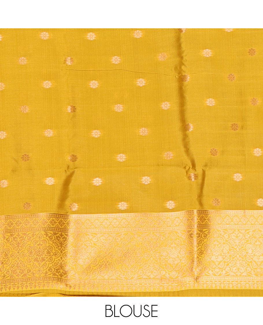 Yellow jacquard kanchi tissue saree, zari chakram motifs border, intricately zari woven pallu, and a matching zari design blouse