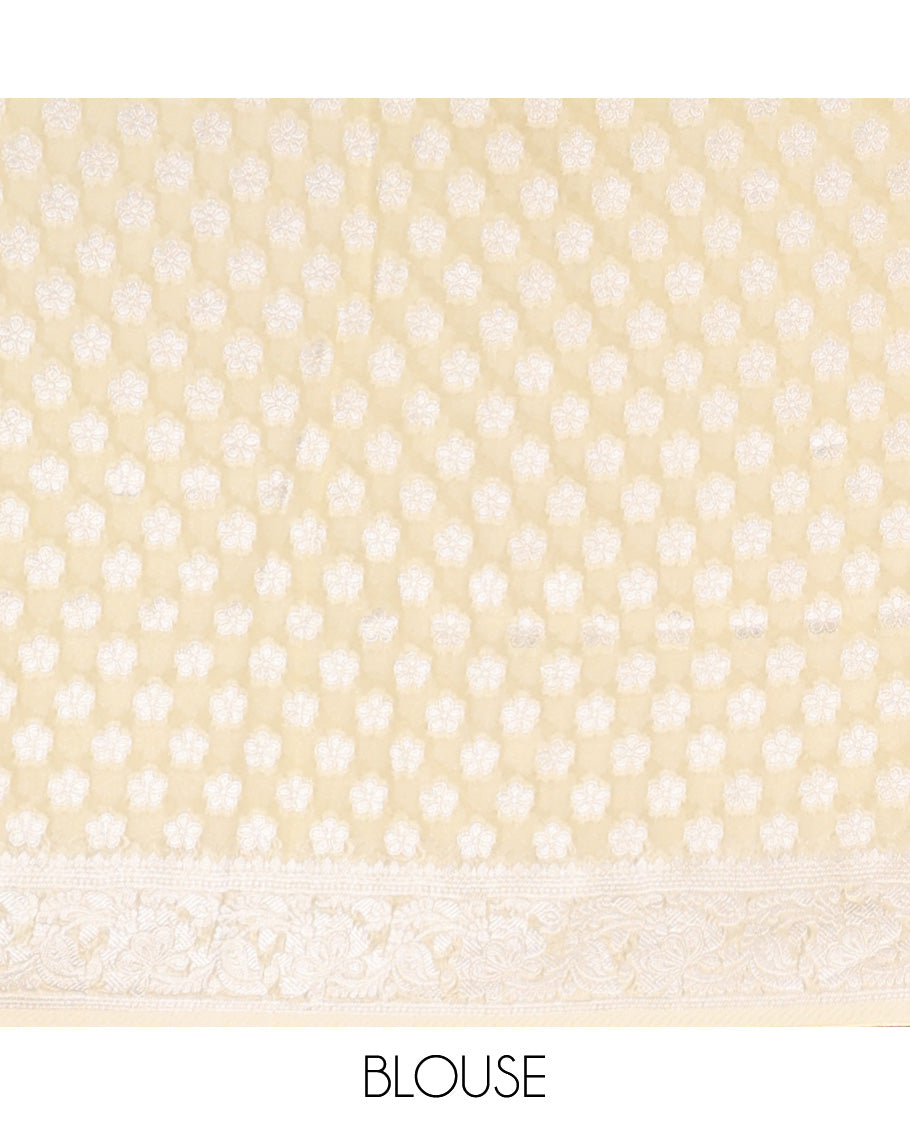 Pale yellow floral jacquard semi-banaras crepe saree, floral creeper border & intricate pallu