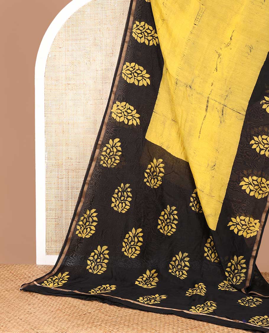 Yellow hanblock batik printed chanderi cotton saree with contrast wax block printed border & hand block printed pallu along with plain blouse