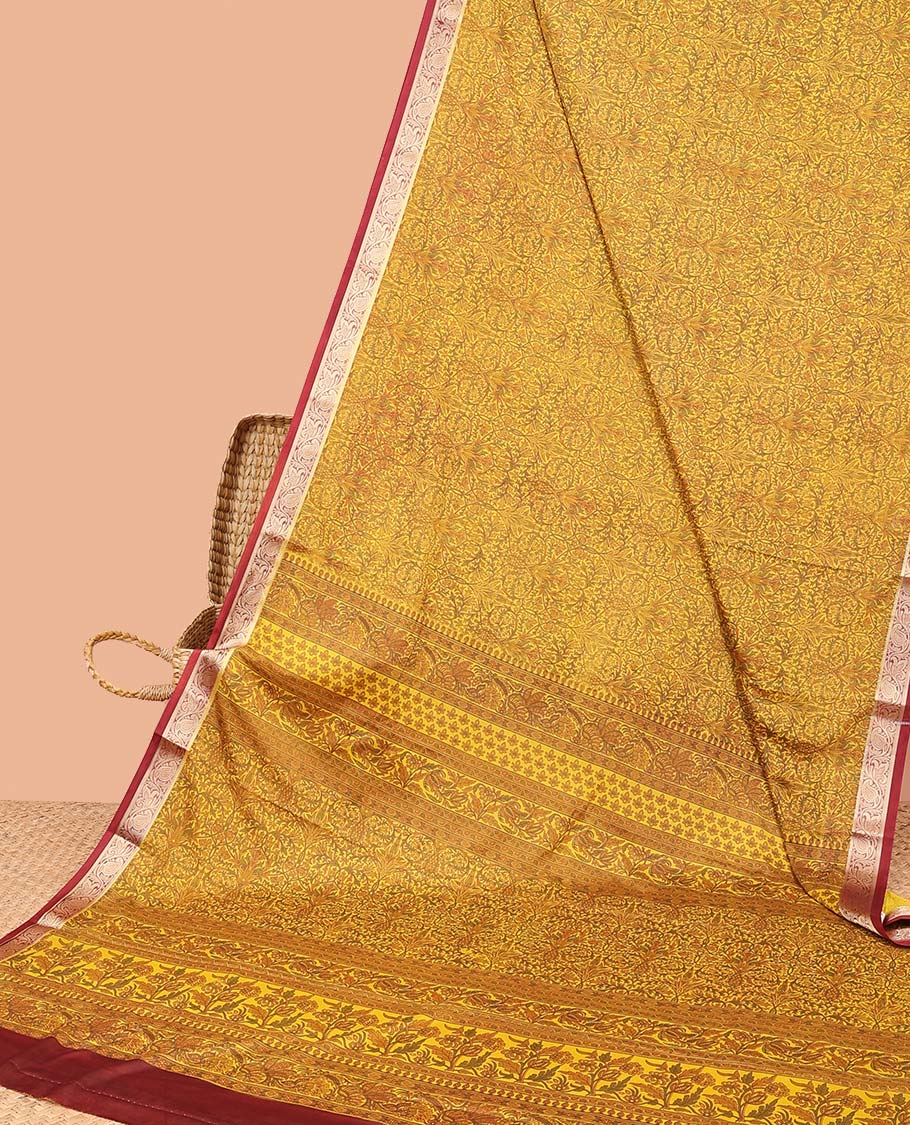 Mustard intricately printed semi-banaras printed saree, contrast floral & paisley border & floral design pallu