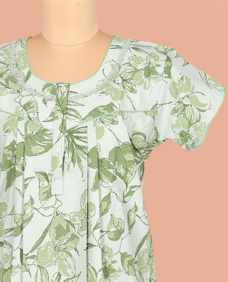 Pale Green Cotton Nighty Subtly Decked Up with Floral Patterns Print, Featuring Lace Work, Round Front Neck, and Half Sleeves