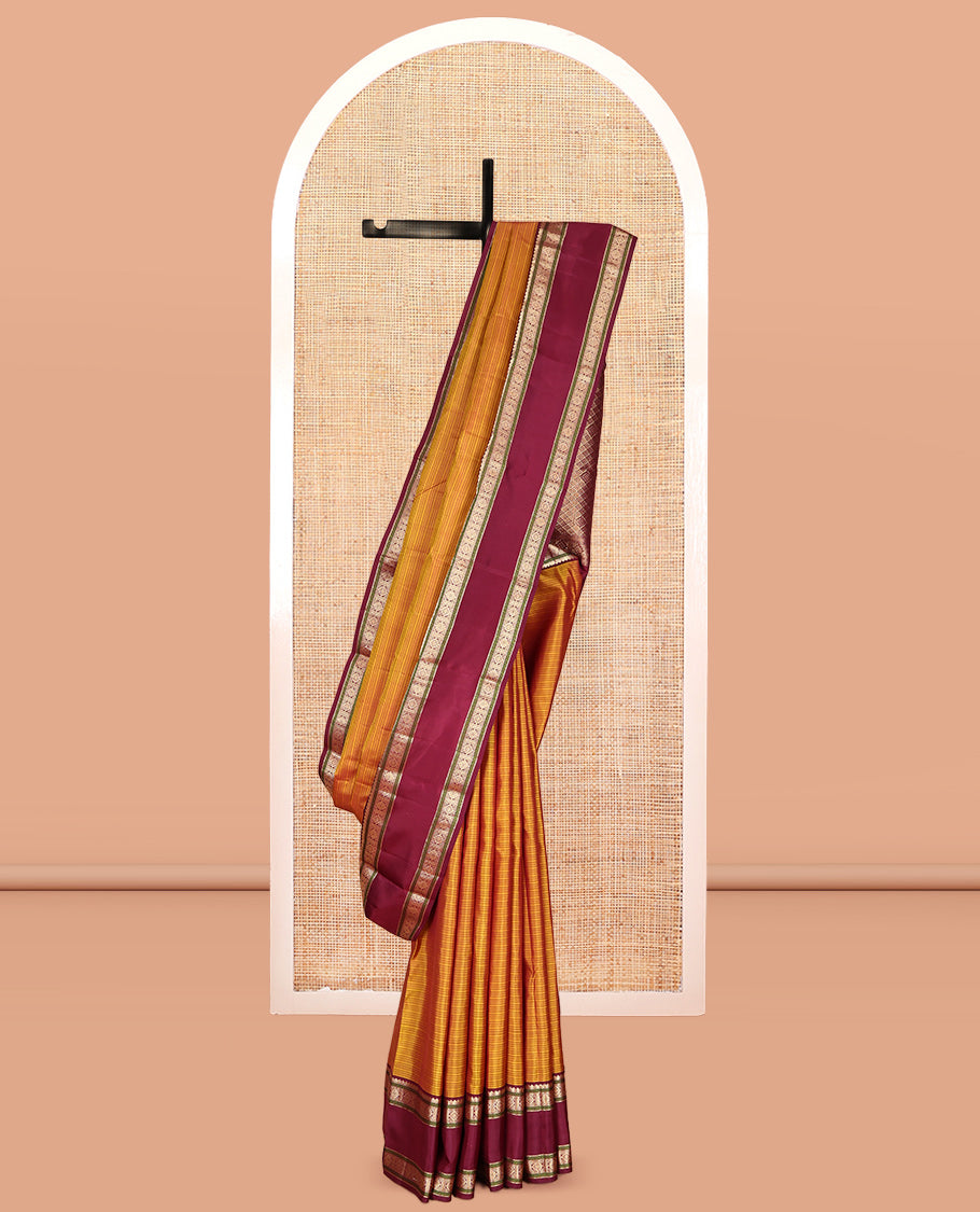 Mustard Striped Kanchipuram Silk Saree, a Contrast Rettai Pettu Border of Thilakam, Rudraksham, and Zari Designs, Intricate Pallu, and a Contrast Blouse