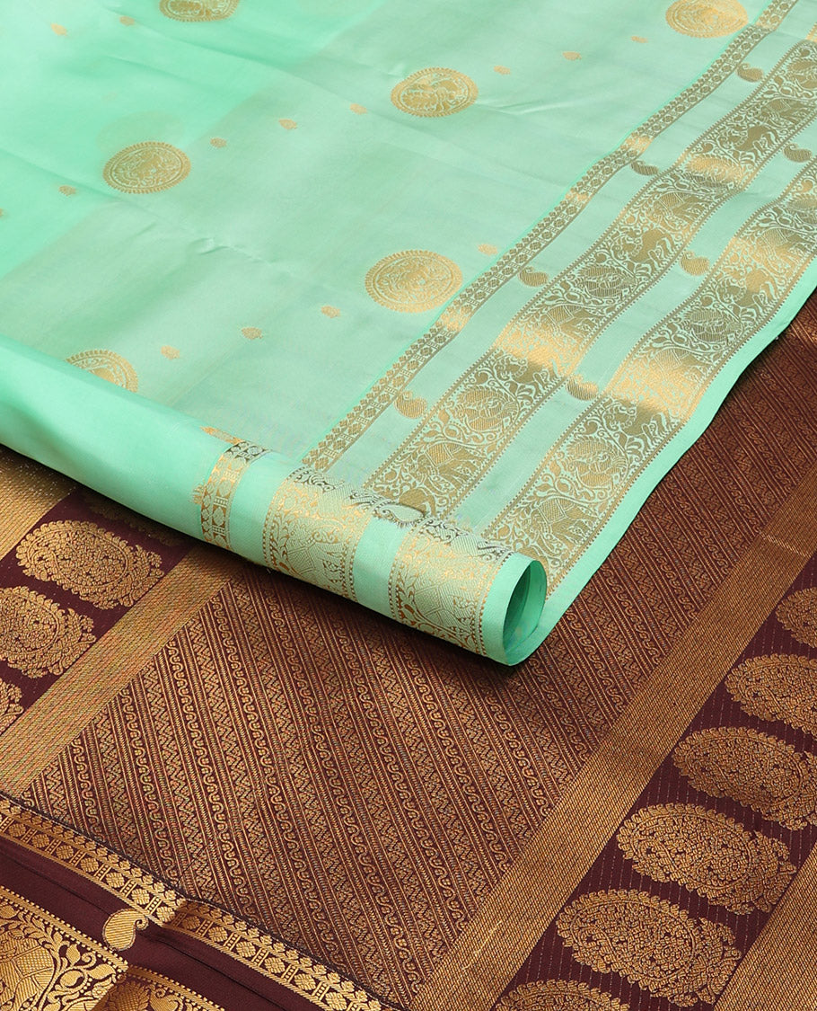 Sea green buttas vasundhara elite silk saree with self zari design border & floral design pallu