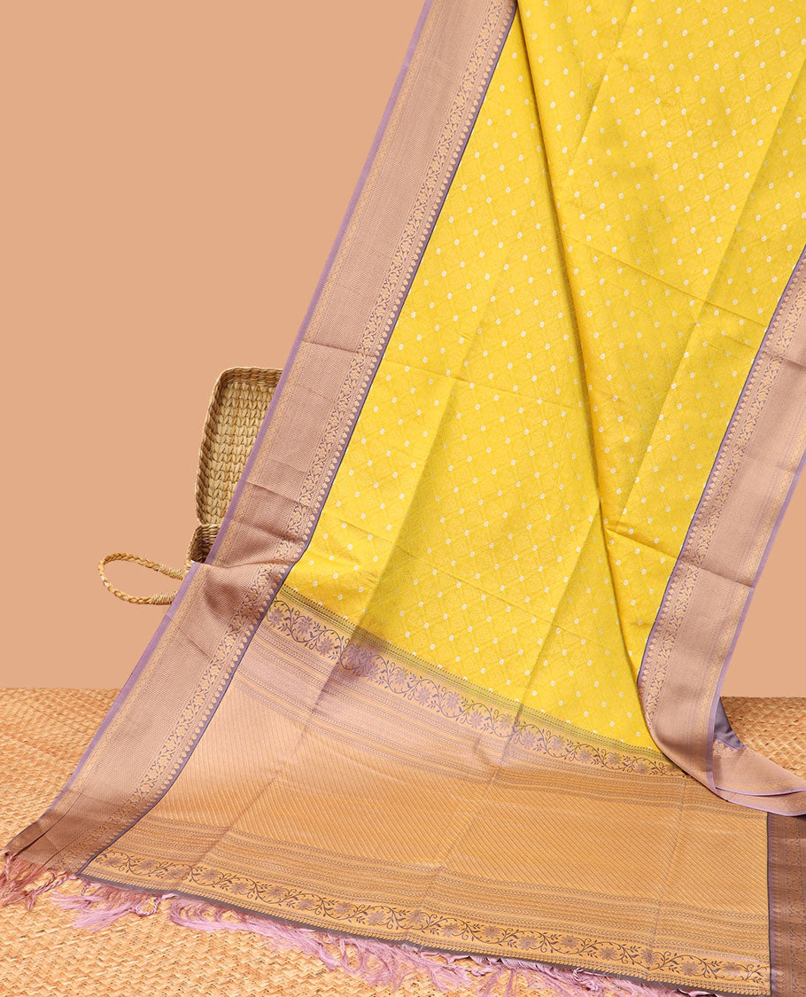 Yellow floral jaal design semi-soft silk saree with contrast intricate zari design border & striped zari design pallu