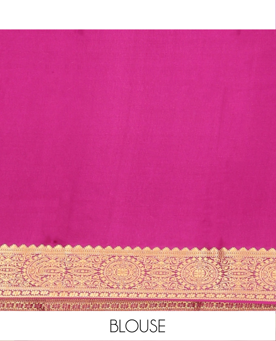 Orange Mysore Silk Saree, Bedecked with Zari Buttas All Over Its Body, Complemented by Captivating Contrast Border of Traditional Zari Designs, Gleaming Zari Striped Pallu, and Paired with a Contrast Blouse