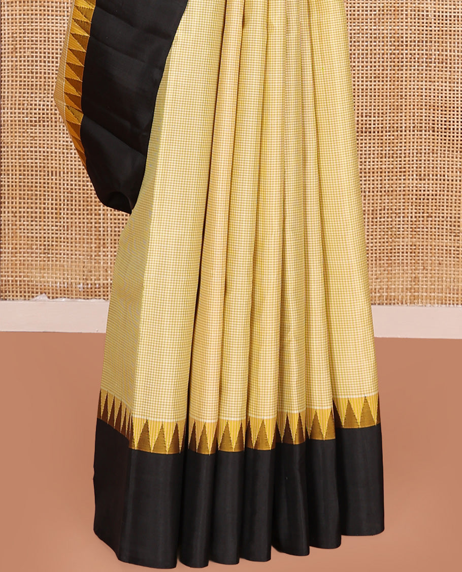 Yellow micro-checked Kanchipuram silk saree, contrast thazampoo rekku border, and striped pallu