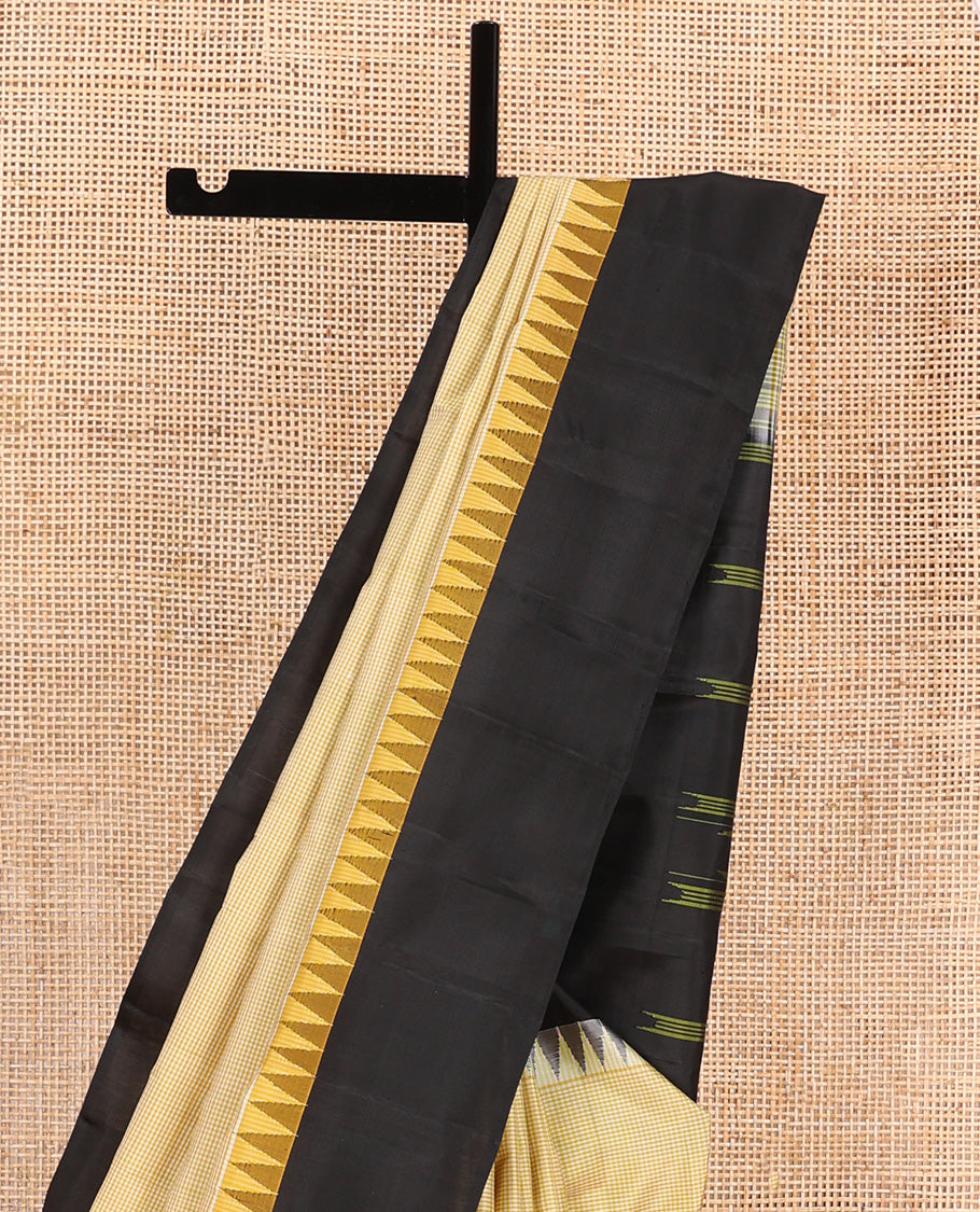 Yellow micro-checked Kanchipuram silk saree, contrast thazampoo rekku border, and striped pallu