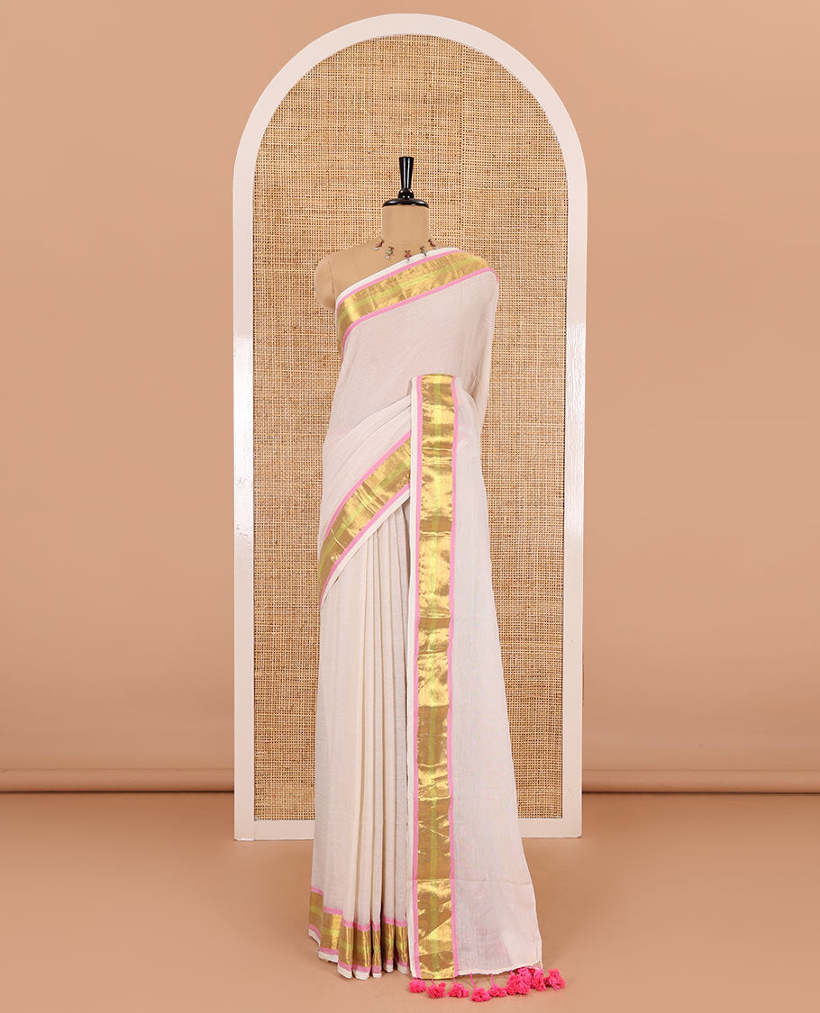 Cream Khadi mul cotton saree, contrast bavanji border, self-pallu with tassels, and a matching blouse