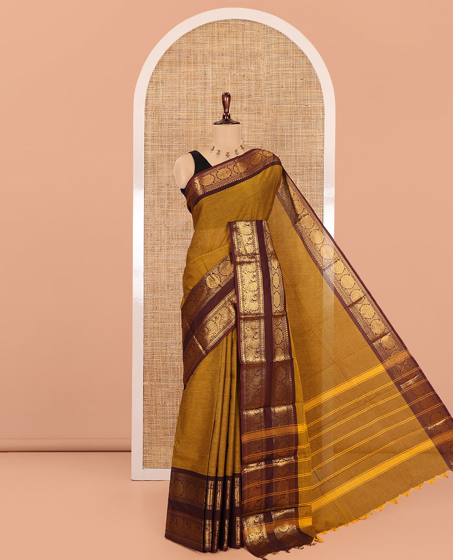 Mustard Chettinad Cotton Saree, a Contrast Peacock-Chakra Rettai Pettu Border, Striped Pallu, and Matching Blouse