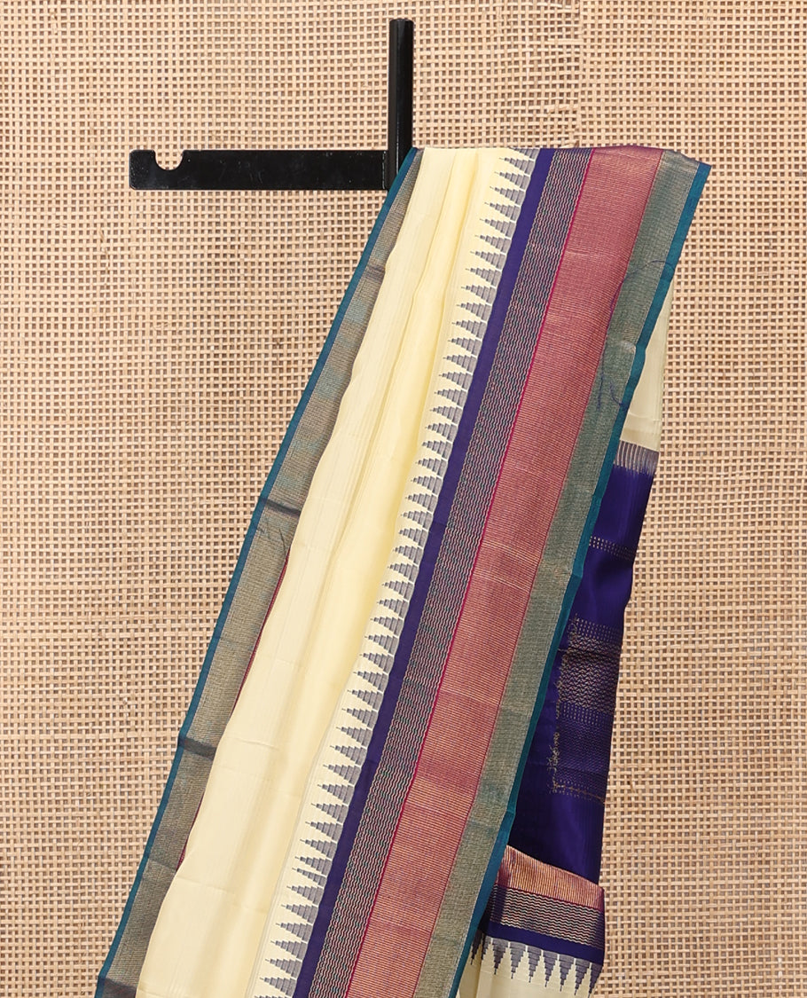 Cream Bangalore Silk Saree, Complemented by a Contrast Temple Border, Pallu of Geometric Designs, and a Contrast Blouse
