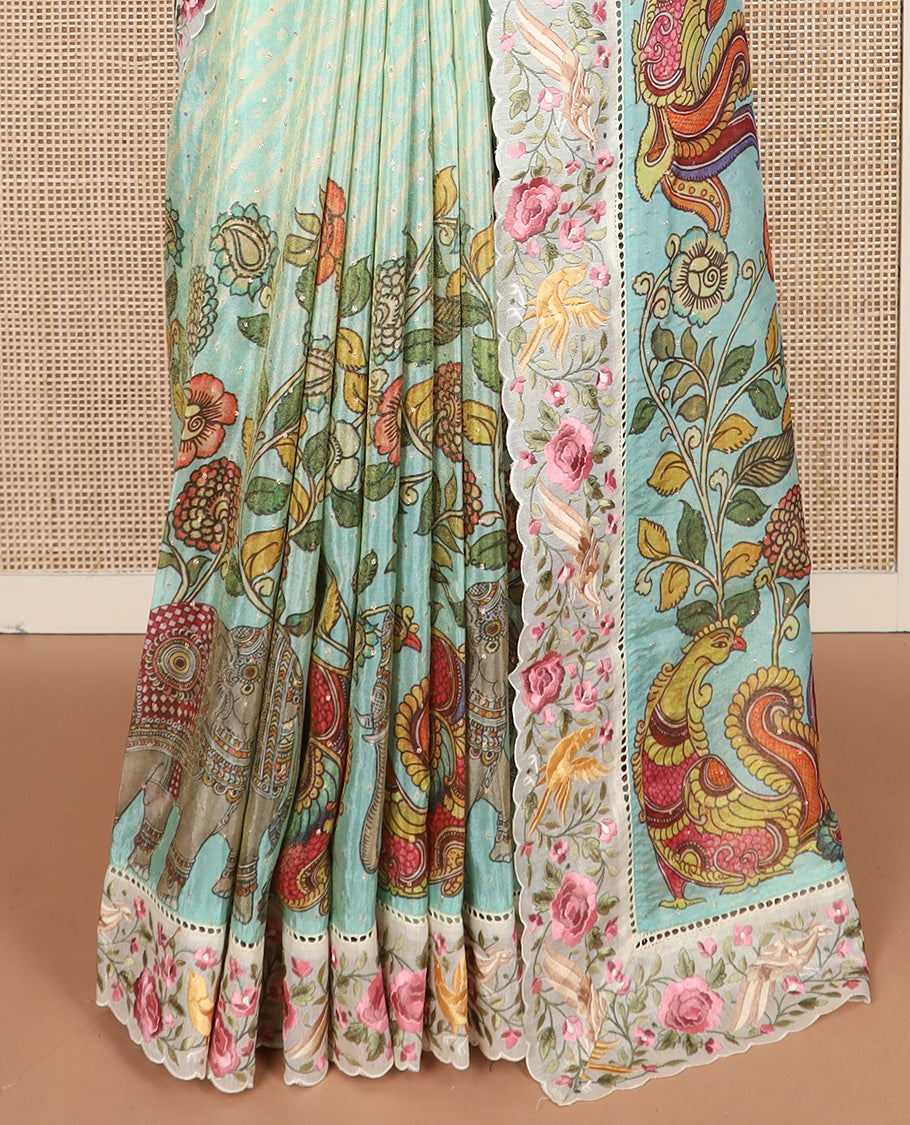 Blue buttas with bandhani and kalamkari floral-fauna printed dola silk saree, contrast floral embroidered scallop border